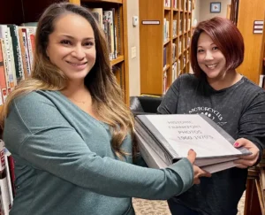 Christy Jones and Charlene Hedges in the Frankfort City Library local history section